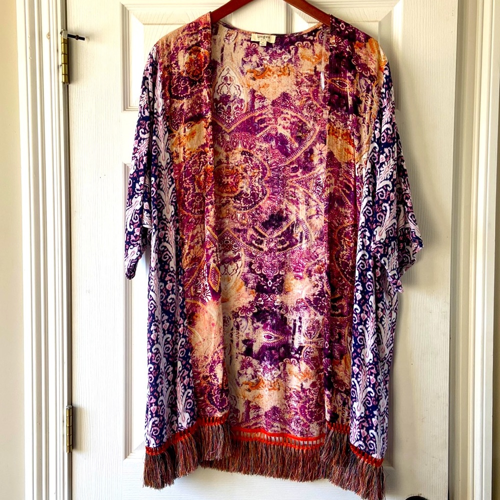 Multi colored Bohemian cardigan with fringe. Pet free smoke free home.